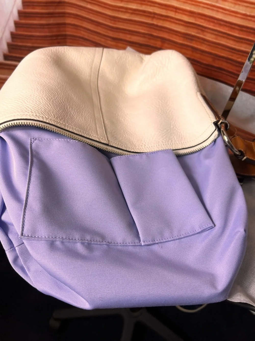 Coach Soho White Pebbled Leather Hobo bag features a distinctive braided handle